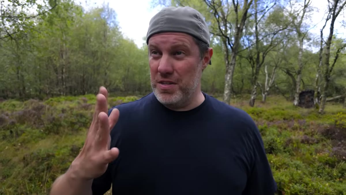 Creator reviewing his own YouTube channel analytics on screen