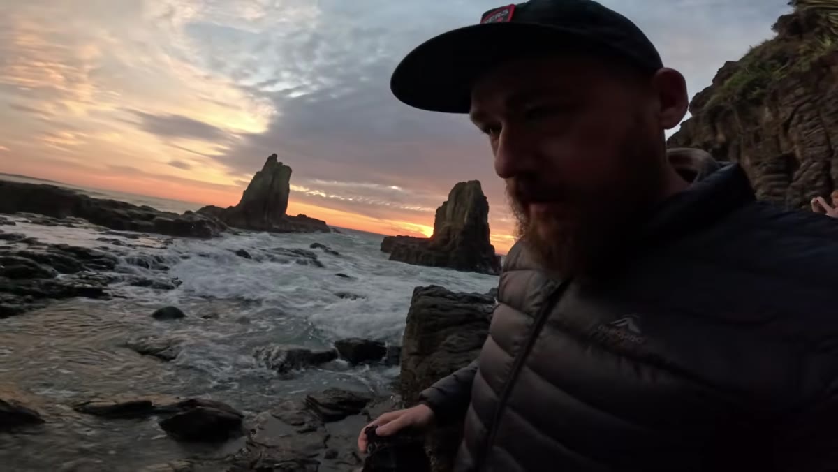 Patino repositioning to face more directly toward the rising sun between rock stacks