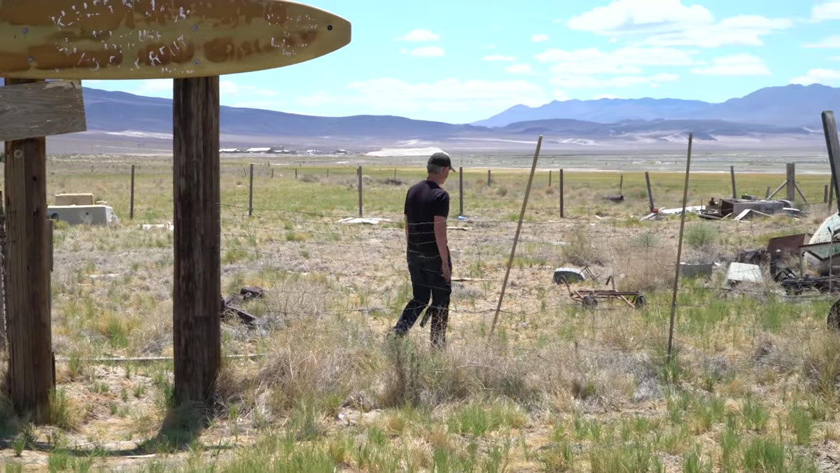 Photographer engaging with a remaining Keeler resident outside their home