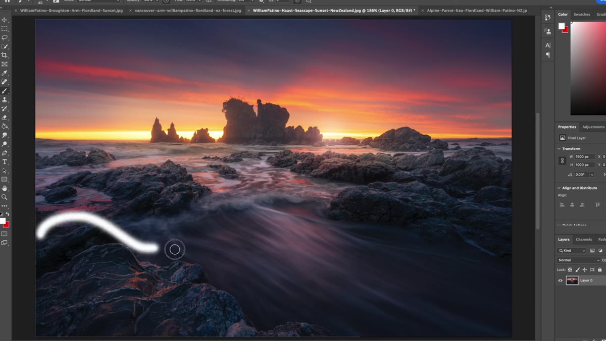 Large foreground rock on left balanced by rocks on right, open water in middle