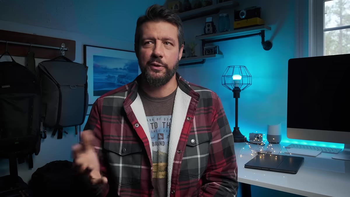 Denney gesturing while explaining video tutorial investment category