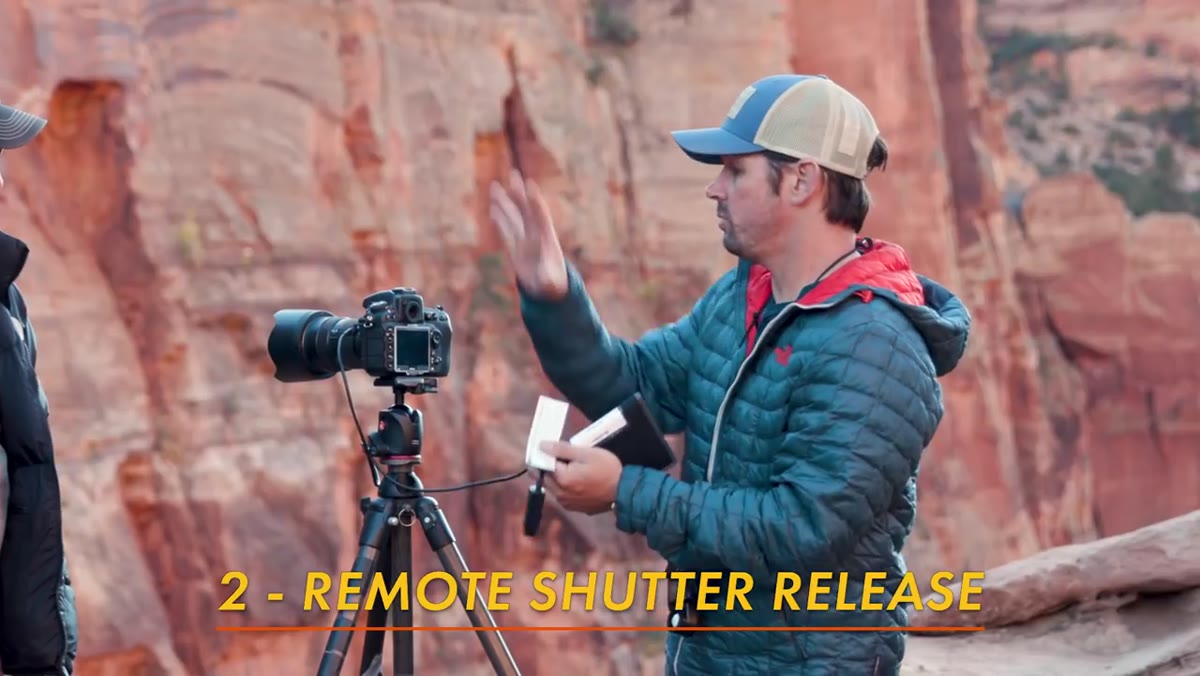 Demonstrating cable release connected to camera on tripod