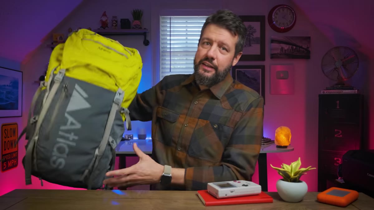 Mark holding the Atlas Athlete Pack on camera