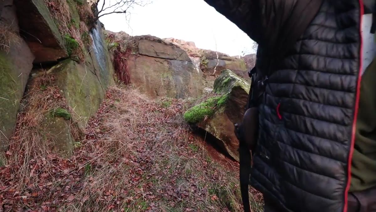 Heaton moving quickly up toward cliff top as golden light intensifies